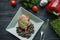 Grilled pork ribs steaks with spices and herbs. Decorated with fresh Bulgarian pepper, cherry tomatoes, lettuce, curly parsley.