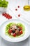 Grilled pork warm salad with sauce, tomatoes, champignon mushrooms, pepper