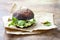 Grilled portobello bun mushroom burger. Vegan, gluten free, grain free, healthy veggies hamburger with guacamole, fresh vegetables