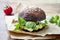 Grilled portobello bun mushroom burger. Vegan, gluten free, grain free, healthy veggies hamburger with guacamole, fresh vegetables