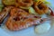 Grilled prawns, squid slices, potato chips