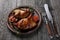 Grilled quails on wooden background