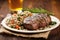 grilled ribeye steak on a bed of wild rice