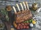 Grilled roasted rack of lamb,mutton with vegetables on a wooden surface
