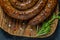 Grilled or Roasted spiral pork sausages with rosemary, salt and peper