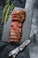 Grilled roasting rare sliced vegas strip steak. Marble meat beef. Black background. Top view