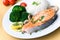Grilled salmon with broccoli rice and tomato- clos