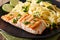 Grilled salmon garnished with fettuccini pasta with cheese, herb