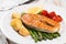 Grilled salmon with green asparagus, cherry tomato and potatoes