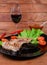 Grilled sappy pork steaks with vegetables and red wine