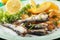 Grilled sardine fish with potato wedges