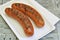 Grilled Sausages on Paper plate