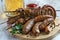 Grilled sausages and shish kebabs with a glass of  beer