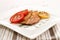 Grilled scottish kipper with rosemary, tomato and slice lemon