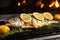 grilled sea bass with lemons on a kitchen counter