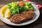 grilled seitan steak with lemon wedges and salad