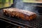 grilled seitan steak next to open grill, smoke rising