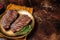 Grilled Shoulder Top Blade or Australia wagyu oyster blade beef steak. Dark background. Top View. Copy space