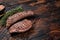 Grilled Sirloin flap or Bavette beef meat steak on a griil with herbs. Wooden background. Top view. Copy space