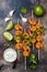 Grilled spicy lime shrimp skewers with creamy avocado garlic cilantro sauce. Top view, overhead, flat lay.