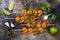 Grilled spicy lime shrimp skewers with creamy avocado garlic cilantro sauce. Top view, overhead, flat lay.