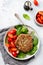 Grilled steak of beef with cherry tomatoes and spinach, garlic, seasonings, peppers and onions.