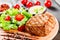 Grilled steak pork with fresh vegetable salad, tomatoes and sauce on wooden cutting board