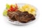 Grilled steaks, boiled potatoes and vegetable salad