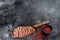 Grilled strip loin steak on a cleaver. The cooking medium. Black background. Top view. Copy space