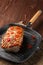 Grilled striploin on grill pan and fried eggplant on wooden background