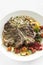 Grilled t-bone steak with peppercorn sauce and vegetables