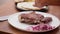 Grilled T-bone steak placed on plate