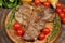 Grilled T bone steak rosemary, with tomatoes, corn, onions and