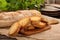 Grilled toasts on old wooden background