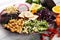 Grilled tofu and dragon fruit buddha bowl with vegetable and humus