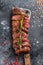 Grilled top blade, Denver steak. Marble meat beef. Black background. Top view