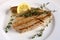 Grilled tuna and lemon wedge