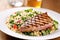 grilled tuna steak on a bed of couscous salad