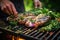 grilled tuna steak being garnished with fresh herbs by hand