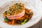 Grilled tuna steak with garnish from salad, carrots and mushroom