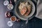 Grilled turkey burgers with spaghetti with classic pesto sauce, sweet paprika and tomatoes. Top view