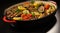 Grilled vegetables in a black casserole dish, AI