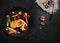 Grilled vegetables in black plate on kitchen table