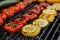 Grilled vegetables on a grill, red pepper and yellow pepper, zucchini