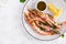 Grilled wild Argentinian red shrimps/prawns with parsley, oil, garlic and lemon.