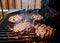 Grilling burgers on a barbecue