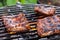 Grilling pork spareribs on barbecue grill