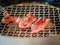 Grilling slices of beef in barbecue restuarant.