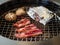 Grilling slices of beef with mushrooms and garlics.