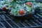 Grilling stuffed Portobello mushrooms on outdoor grill